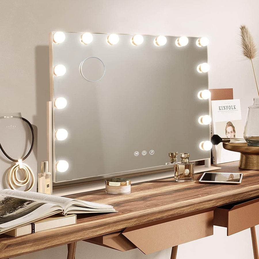 A large makeup mirror with built-in LED lights, capable of 360-degree rotation, placed on a dressing table with various makeup items and a mobile phone.