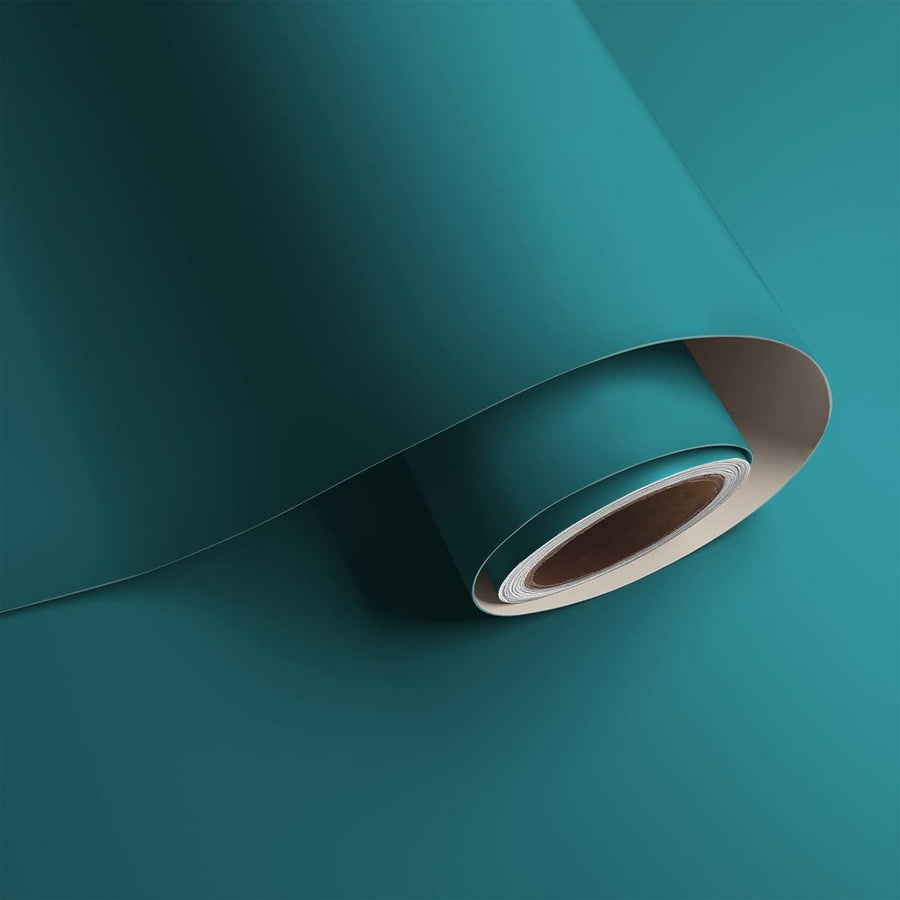 A roll of green self-adhesive vinyl wallpaper.