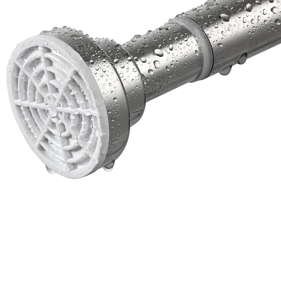 Close-up of a shower head with water droplets on a white background