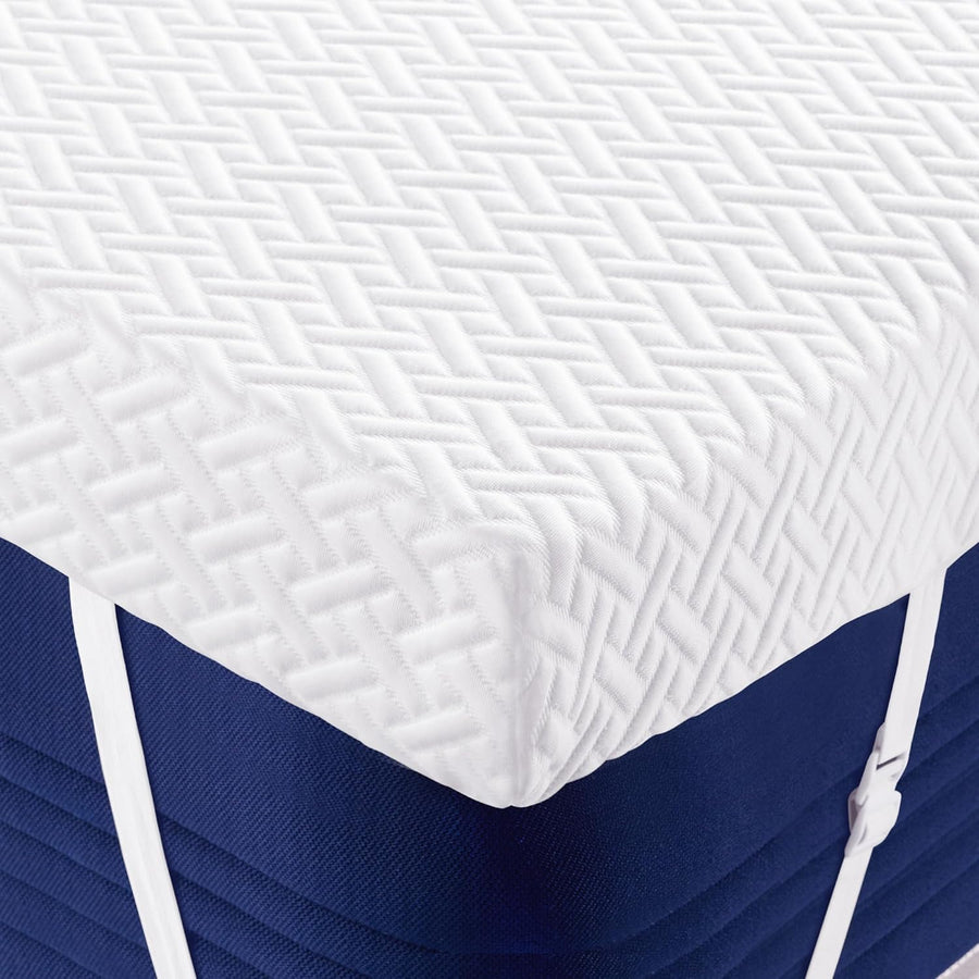 Blue and white mattress with textured cover