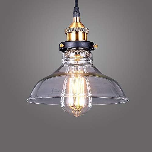 Vintage-style pendant light with clear glass shade and gold metal fitting on a gray background