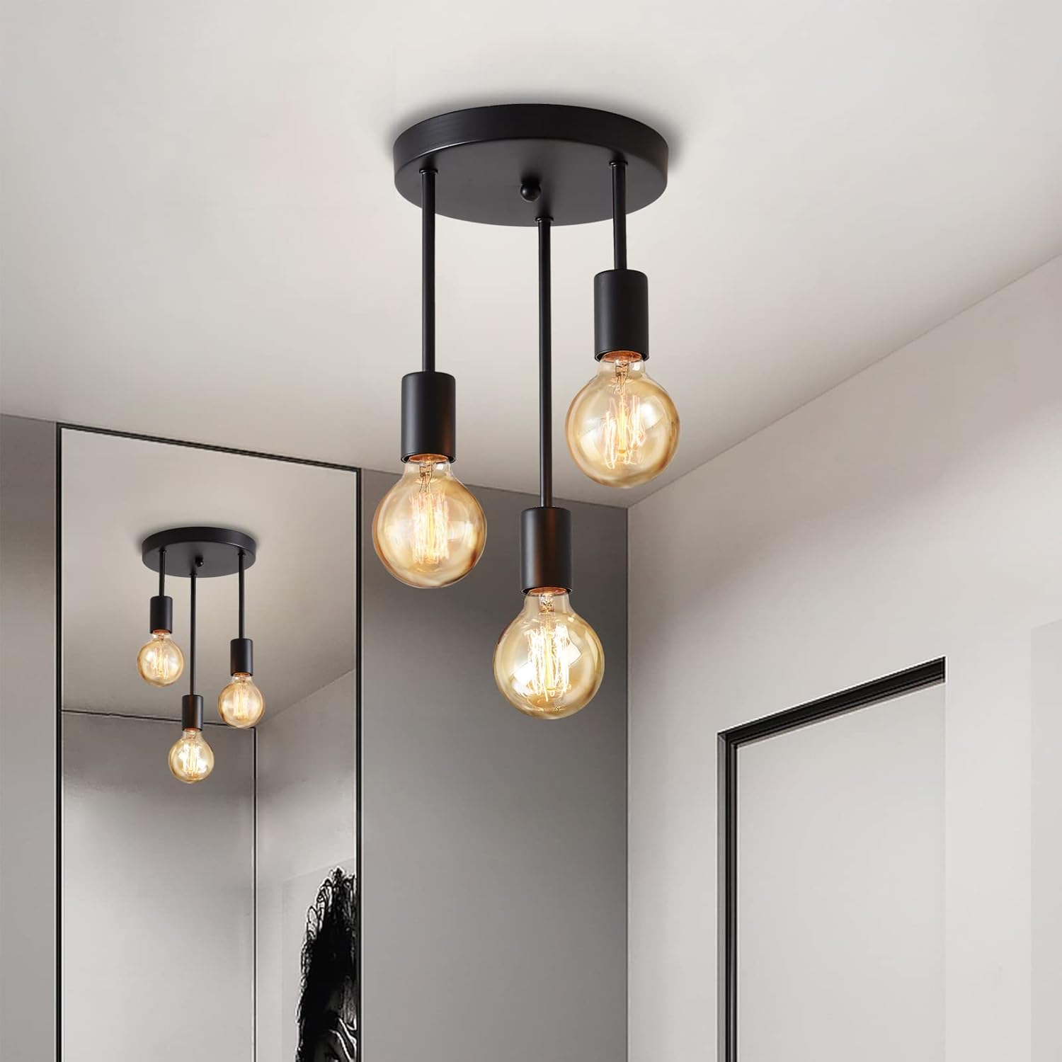 Modern ceiling light fixture with three illuminated bulbs in a room setting.