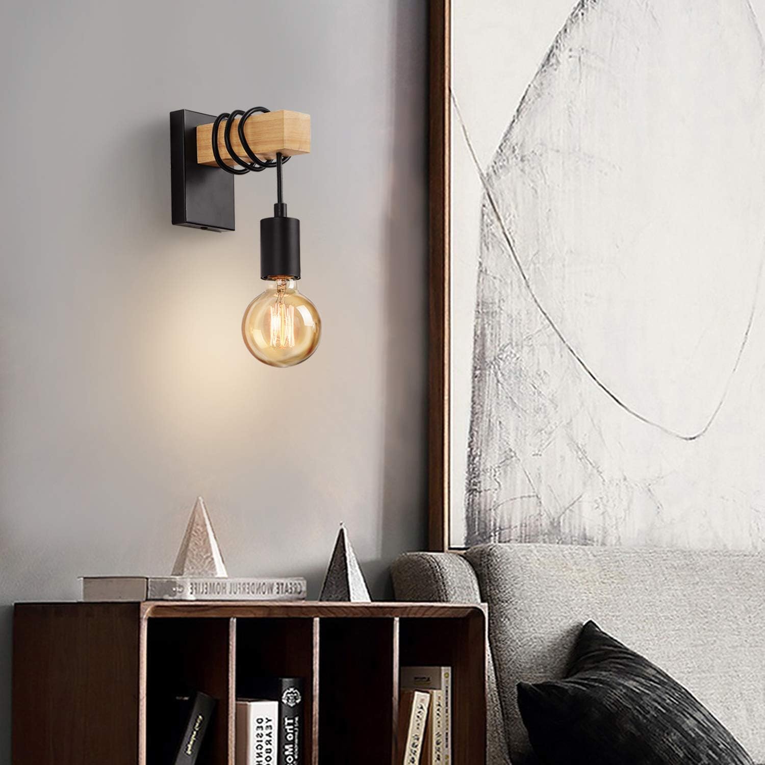 Wall-mounted light fixture with a warm glow in a modern interior setting.