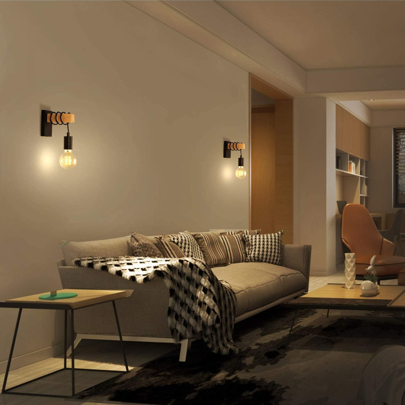 Modern living room with a gray sofa, wooden coffee table, and wall lights.