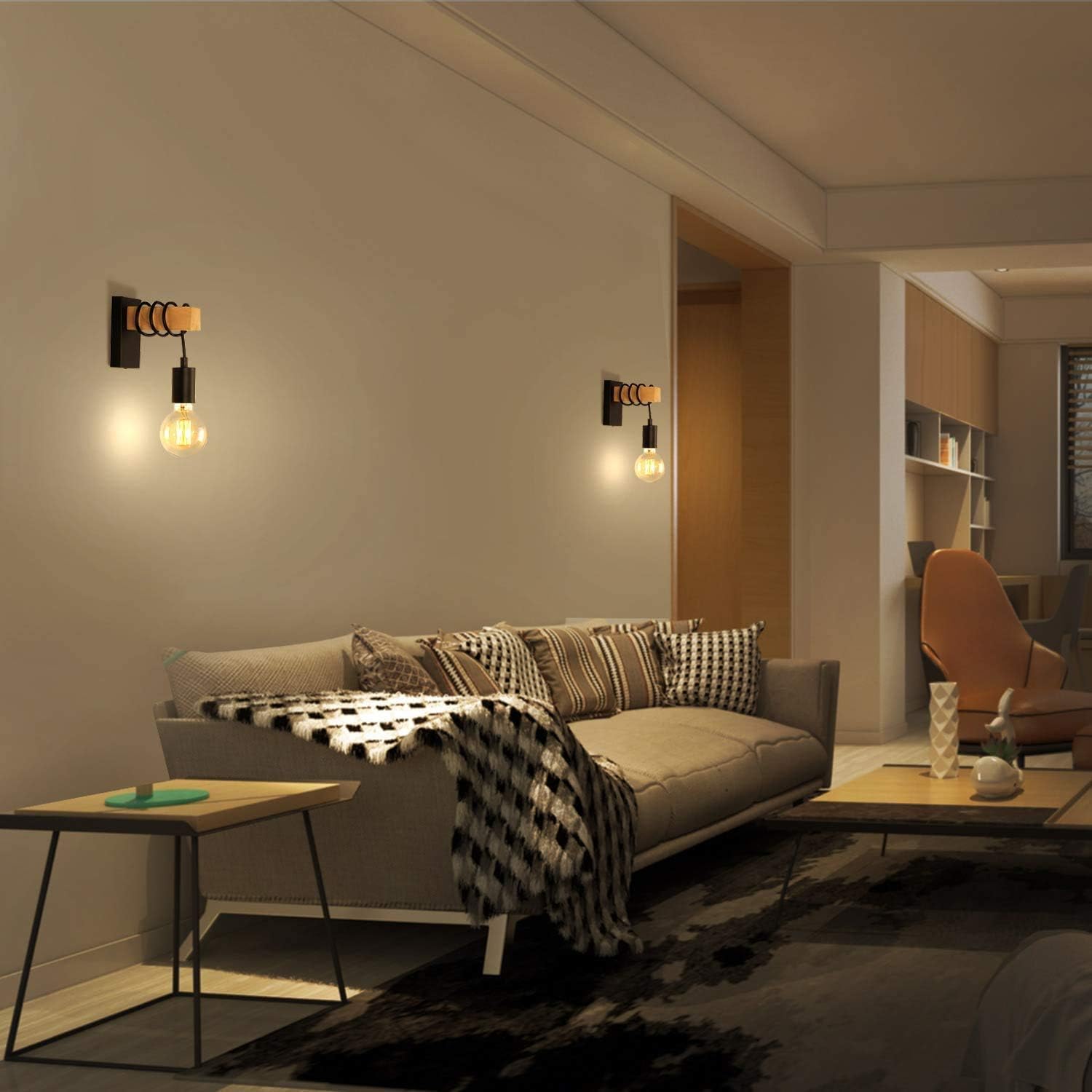 Modern living room with a gray sofa, wooden coffee table, and wall lights.