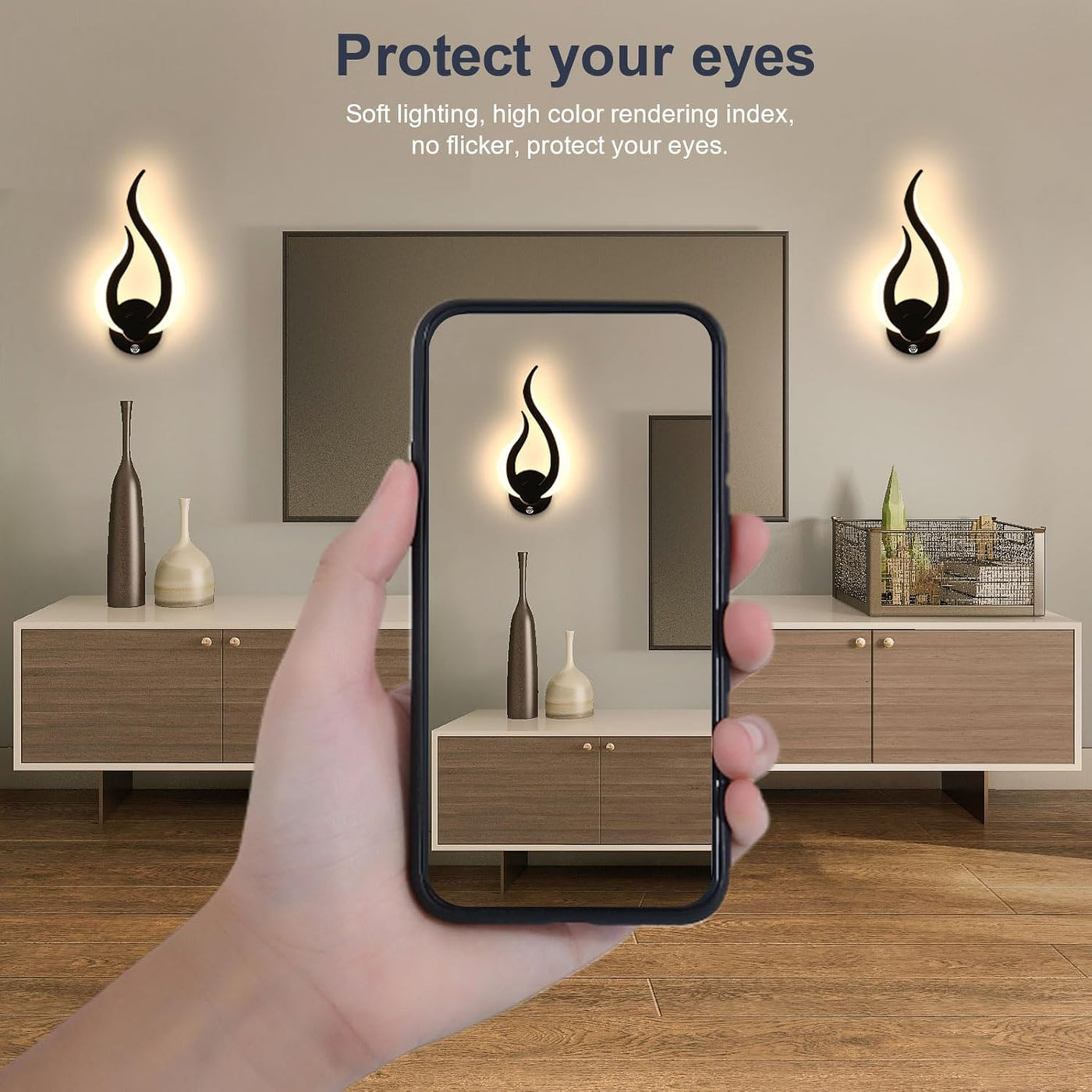 Hand holding a phone taking a photo of a modern interior design with wall lights.