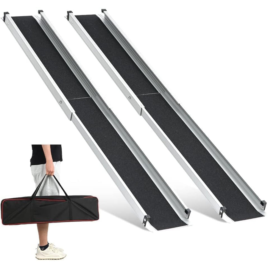 Two telescopic wheelchair ramps placed side by side with a person holding a carrying bag for the ramps.