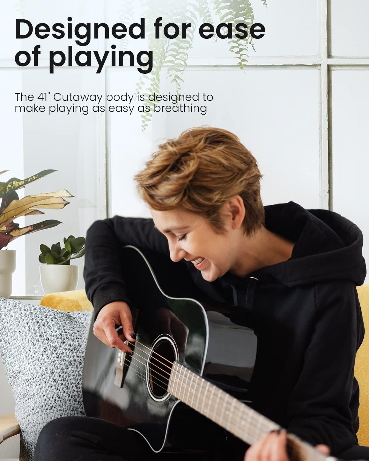 Person playing an acoustic guitar with text about ease of playing on a light background