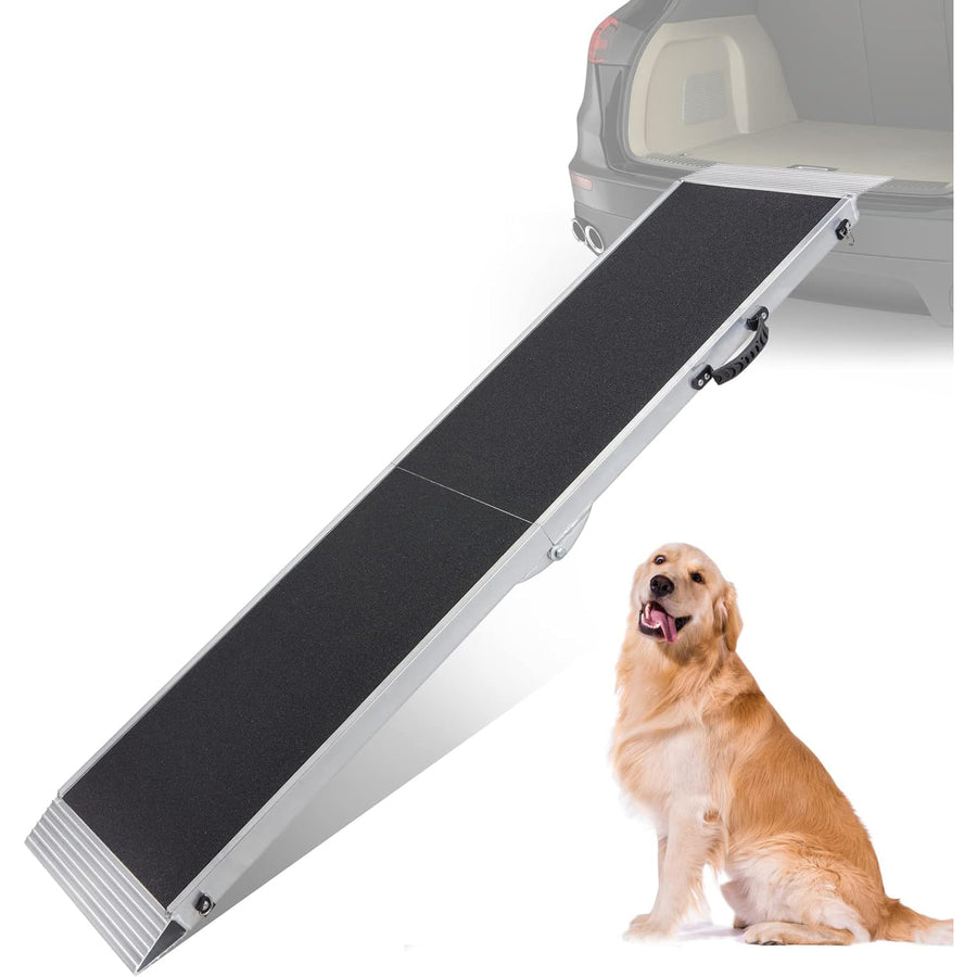An aluminum pet ramp with anti-slip surface shown folded and placed against a car, with a happy dog sitting next to it.