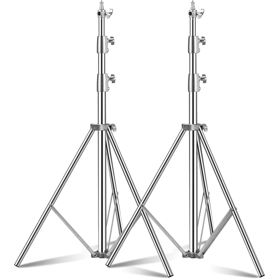 Two metal tripod stands on a white background