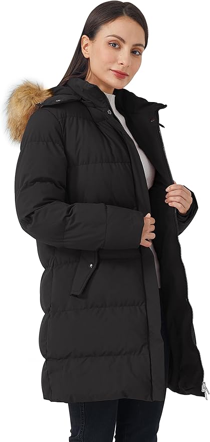 Woman wearing a black puffer coat with fur hood on a white background