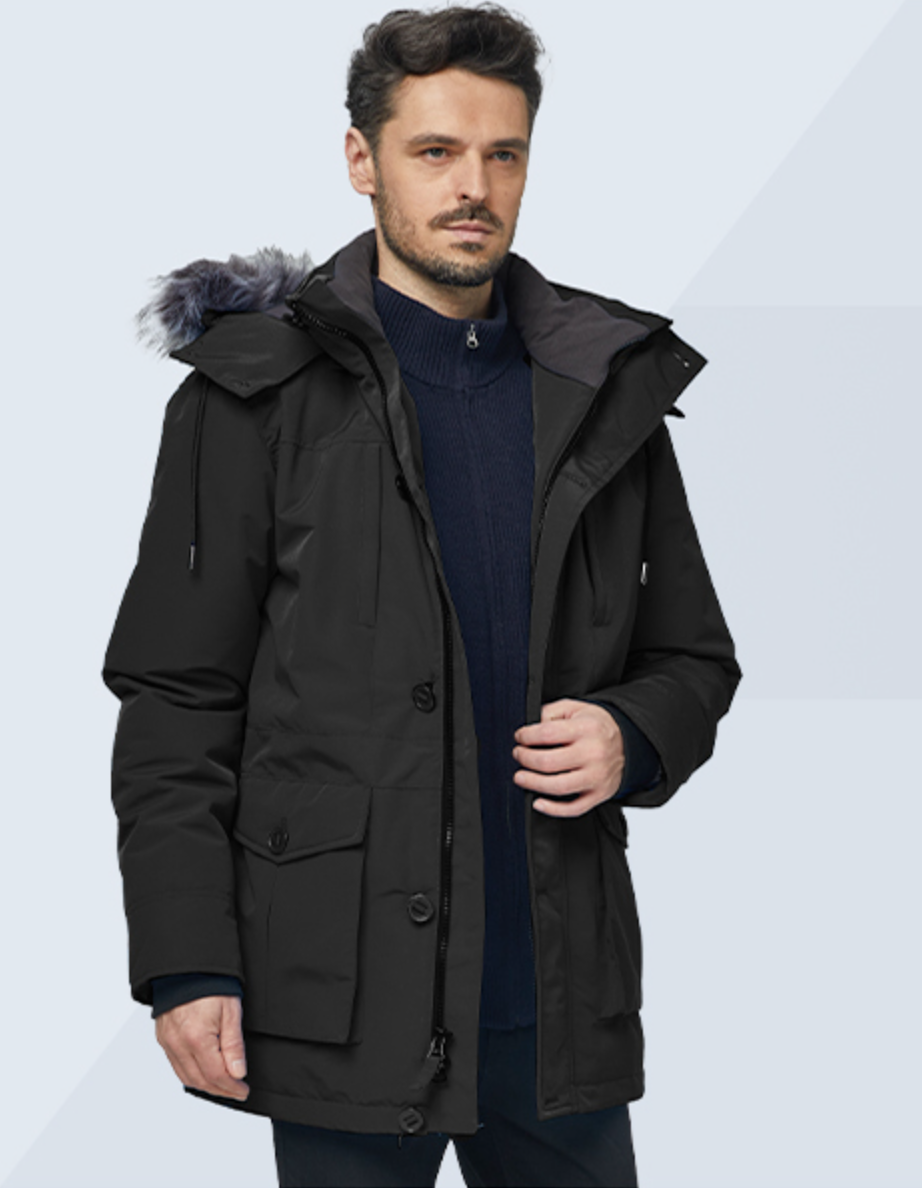 Man wearing a black parka coat with a fur-lined hood on a light blue background