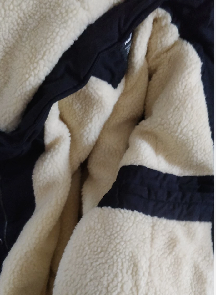 Close-up of a textured fabric with black and beige colors