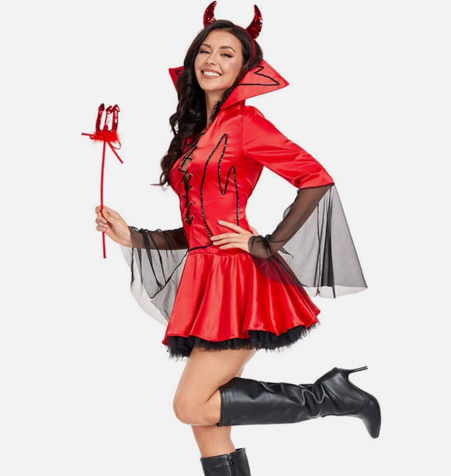 Woman in a red devil costume with black wings and horns, holding a red staff on a white background.