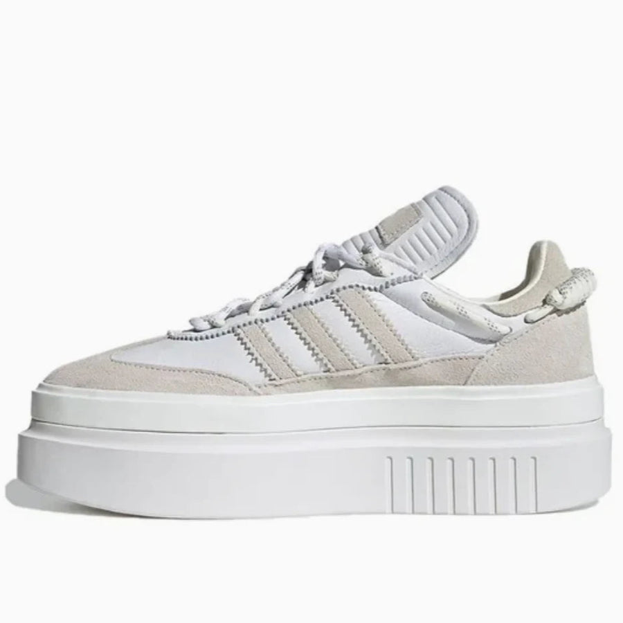 A pair of Adidas Originals x Ivy Park Super Sleek 72 white leather sneakers with an exaggerated double-stacked midsole and bungee detail.