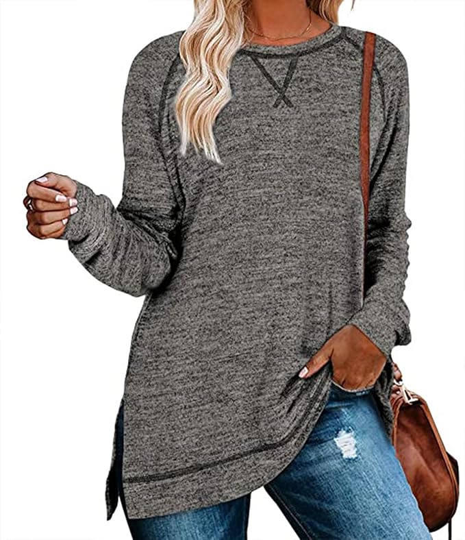 Person wearing a gray long-sleeve top with a brown bag over one shoulder.