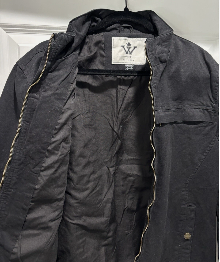 Black jacket with a brand label on a white background