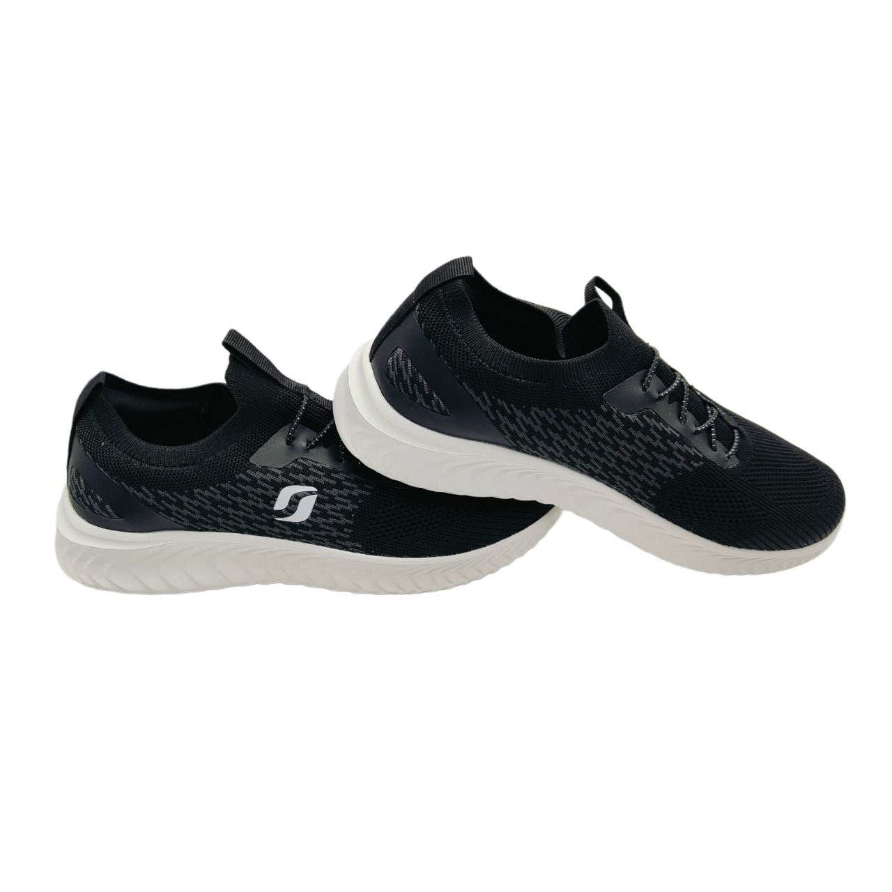 A pair of black-white sneakers with a textured upper and a logo on the side.