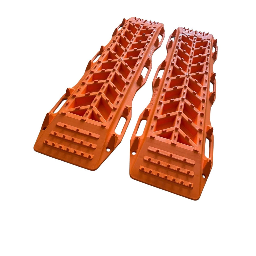 Two orange plastic ramps on a white background