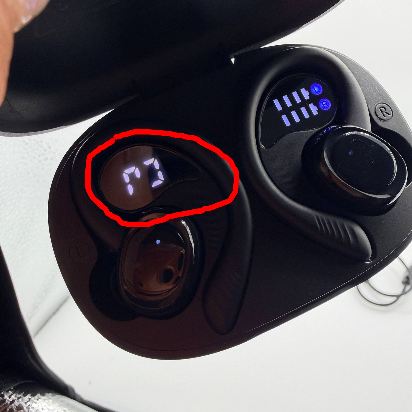 Wireless earbuds with charging case on a white background