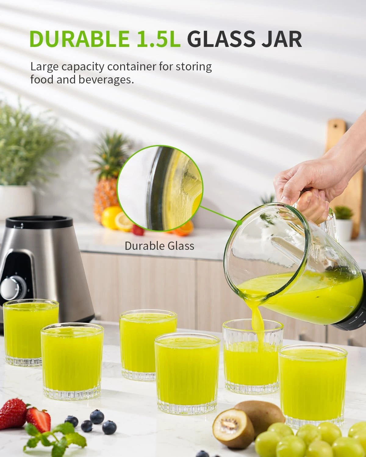 Durable 1.5L glass jar being used to pour juice into glasses on a kitchen counter.