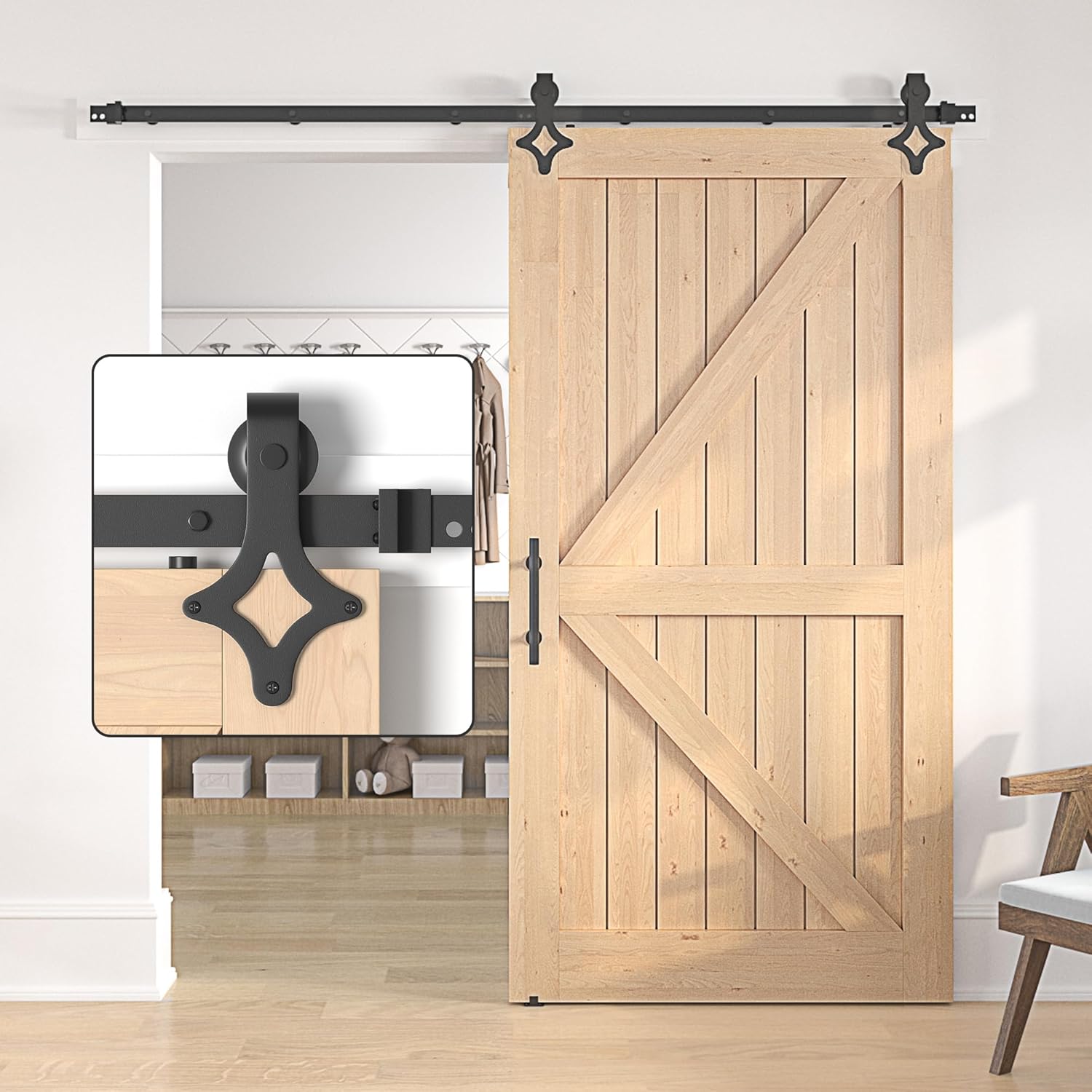 Wooden sliding barn door with black hardware in a room setting.
