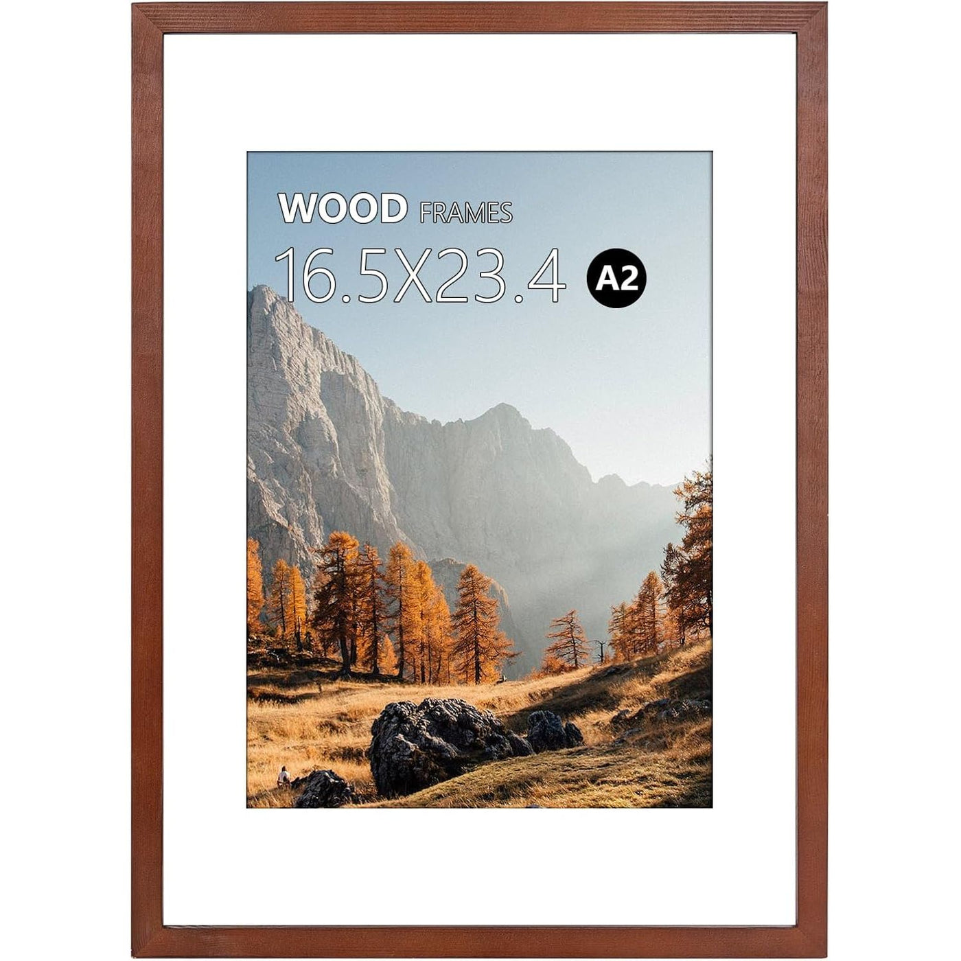 Wooden picture frame with a scenic print of mountains and trees on a white background