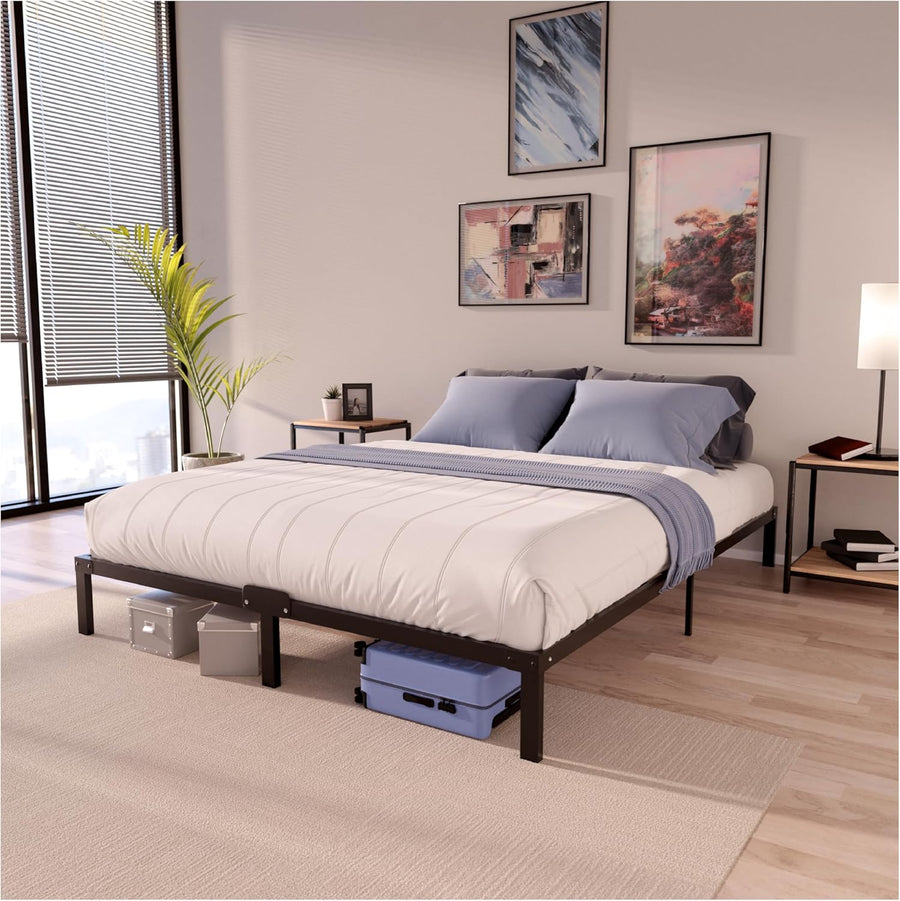 Bedroom with a bed frame, pillows, and a suitcase underneath.