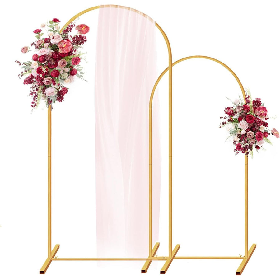 Gold arch with floral decorations and a pink fabric backdrop on a white background