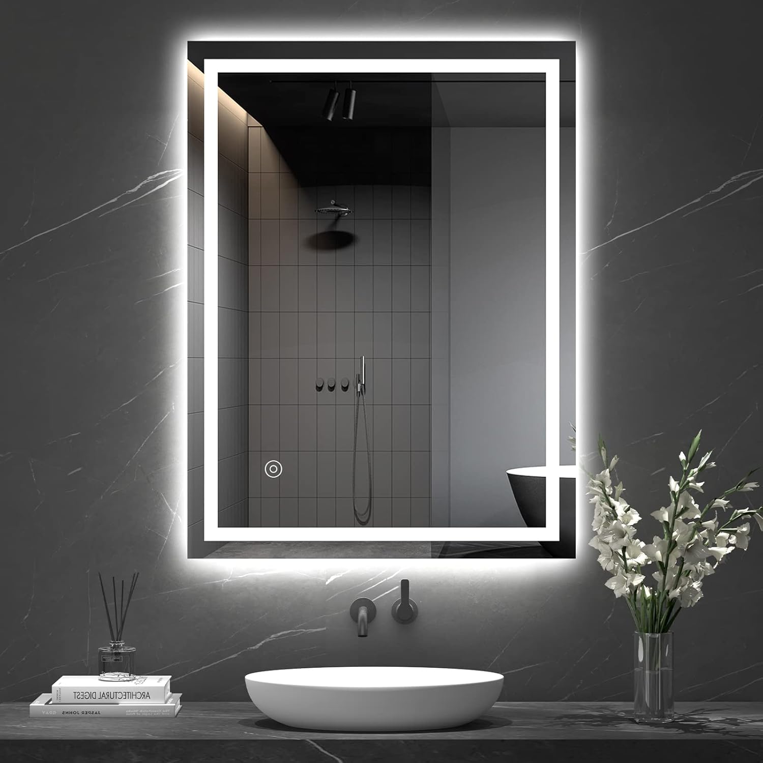 Bathroom with a large illuminated mirror above a sink, featuring modern fixtures and decor.