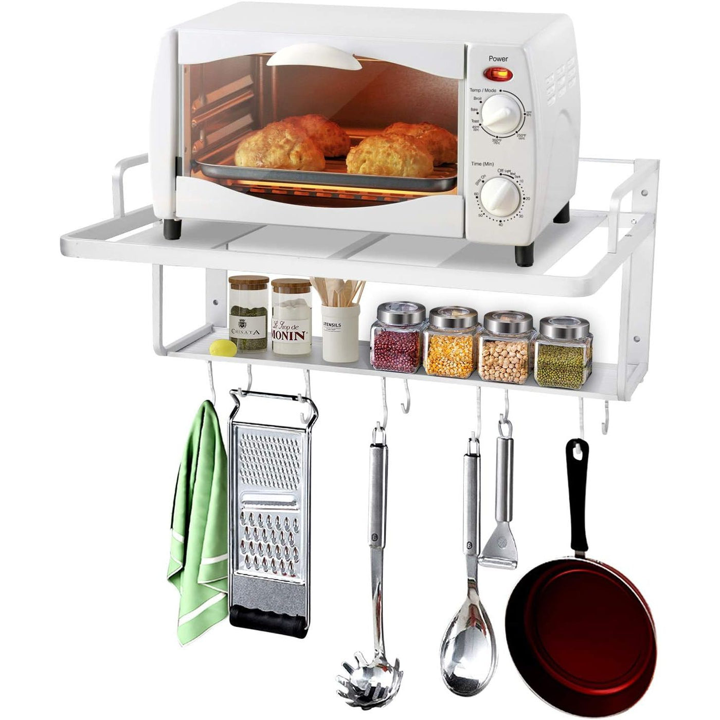 Wall-mounted kitchen organizer with toaster oven, spices, utensils, and a pan.