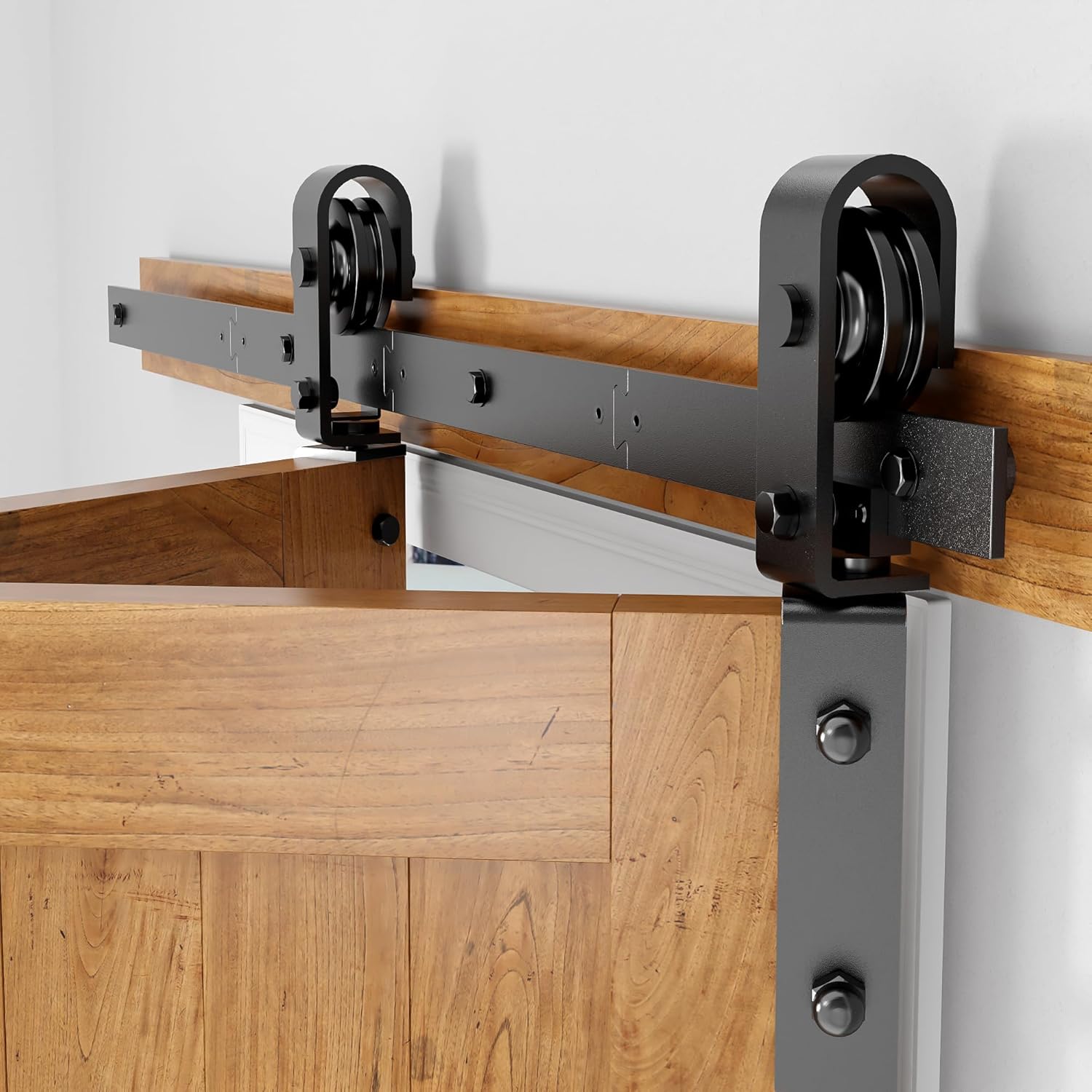 Wooden sliding door mechanism with metal rollers on a white background