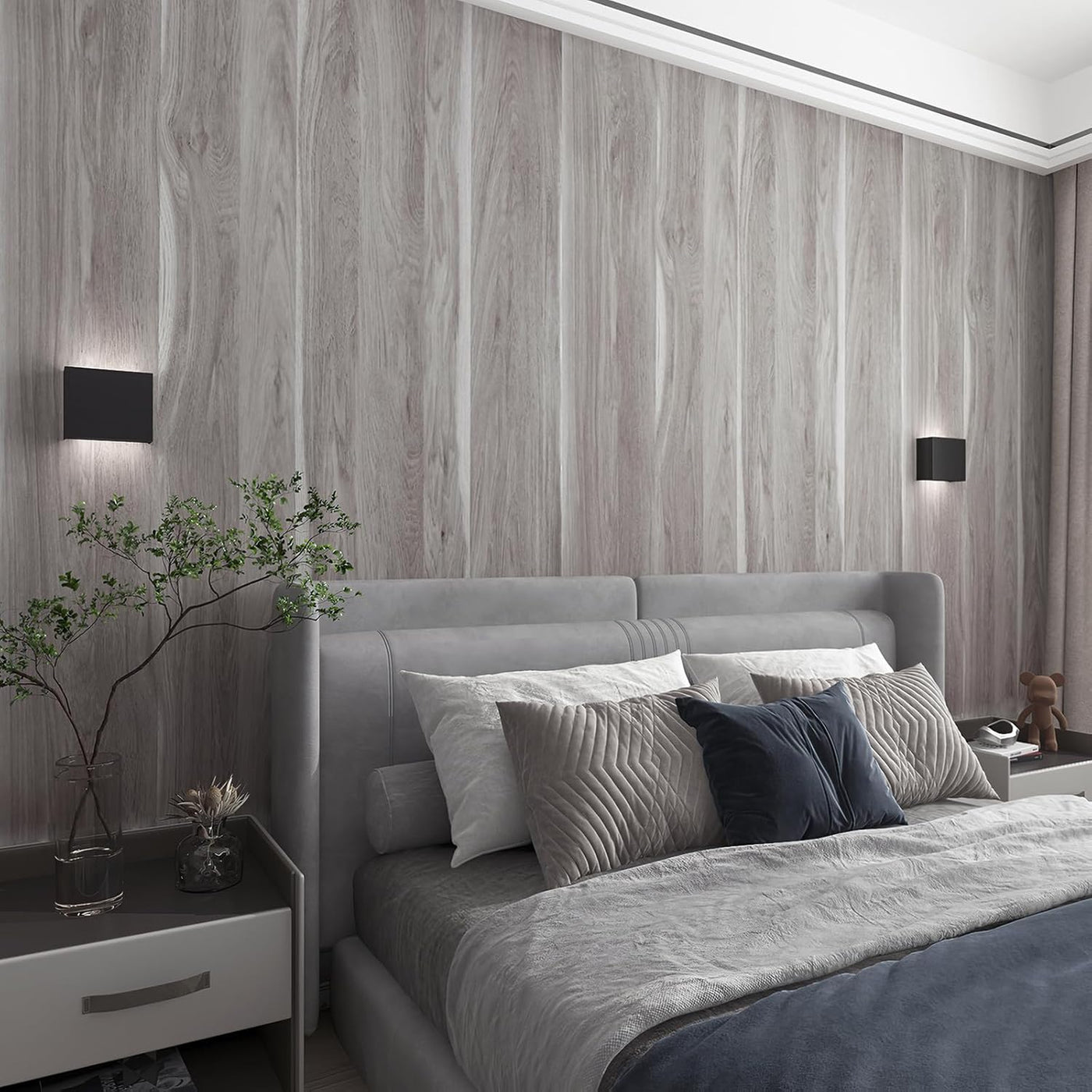 Modern bedroom with gray upholstered bed and wooden wall.