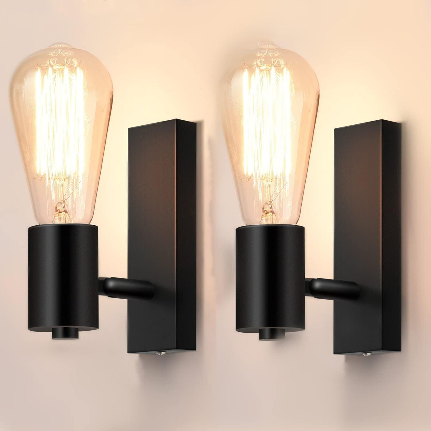 Black wall sconces with vintage-style light bulbs on a neutral background