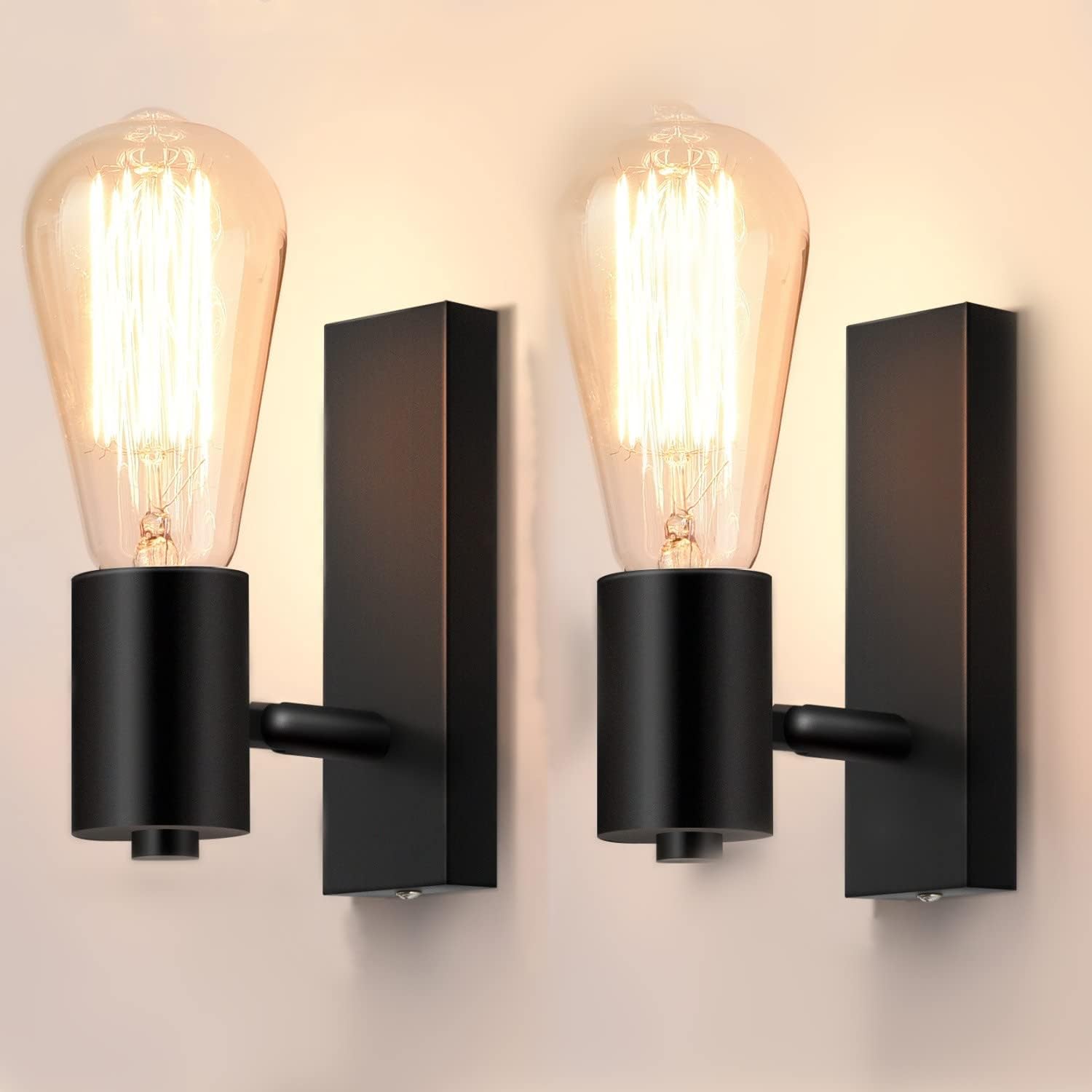 Black wall sconces with vintage-style light bulbs on a neutral background