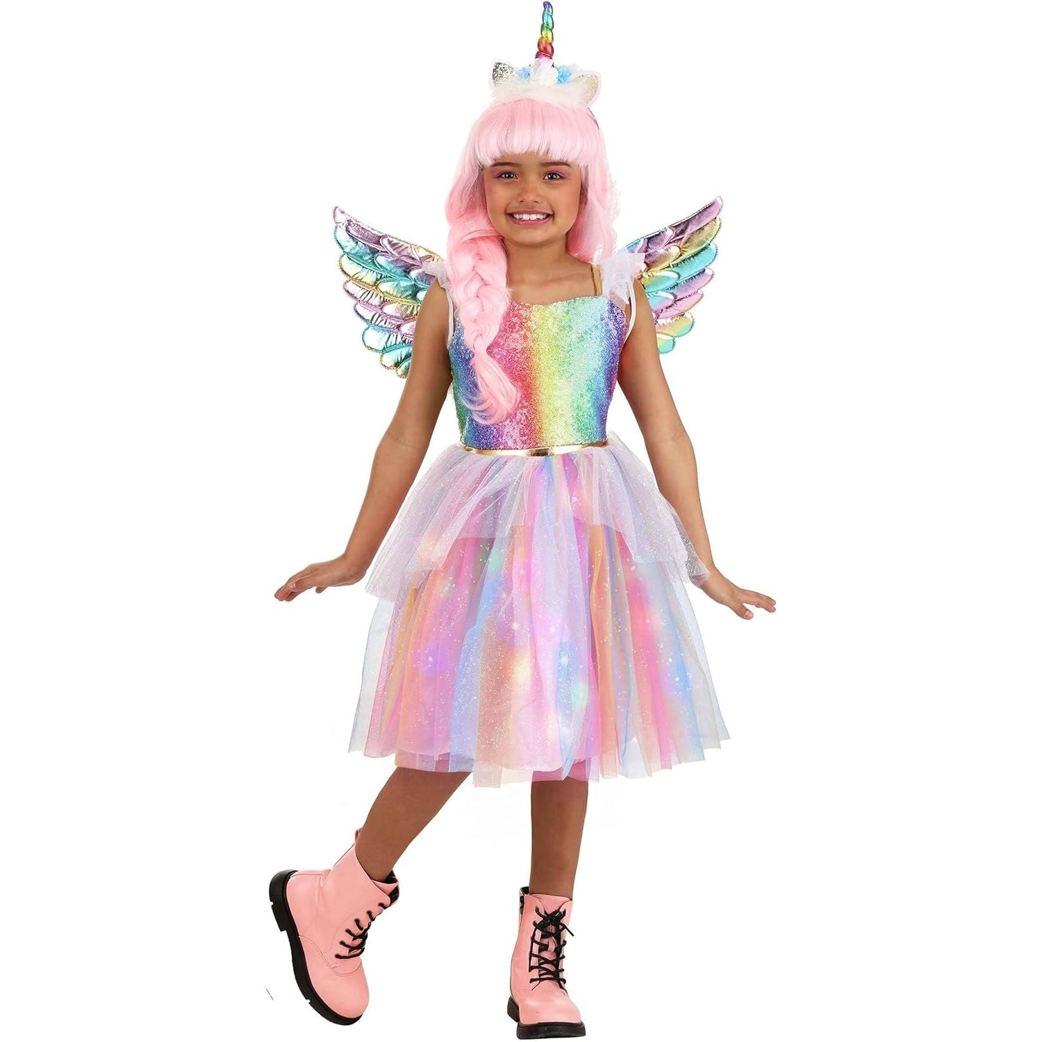 Child wearing a colorful unicorn costume with wings on a white background