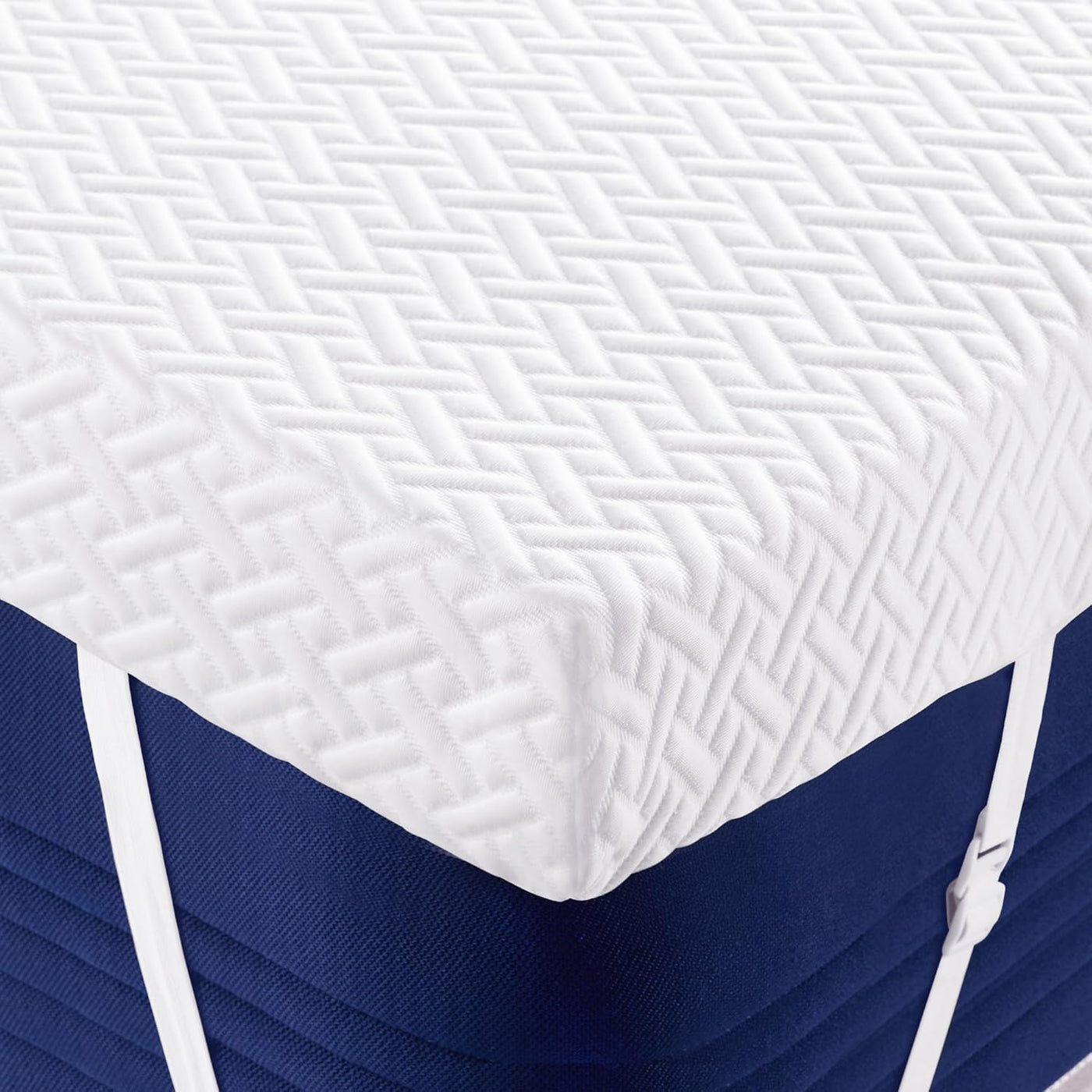 Blue and white mattress with textured cover