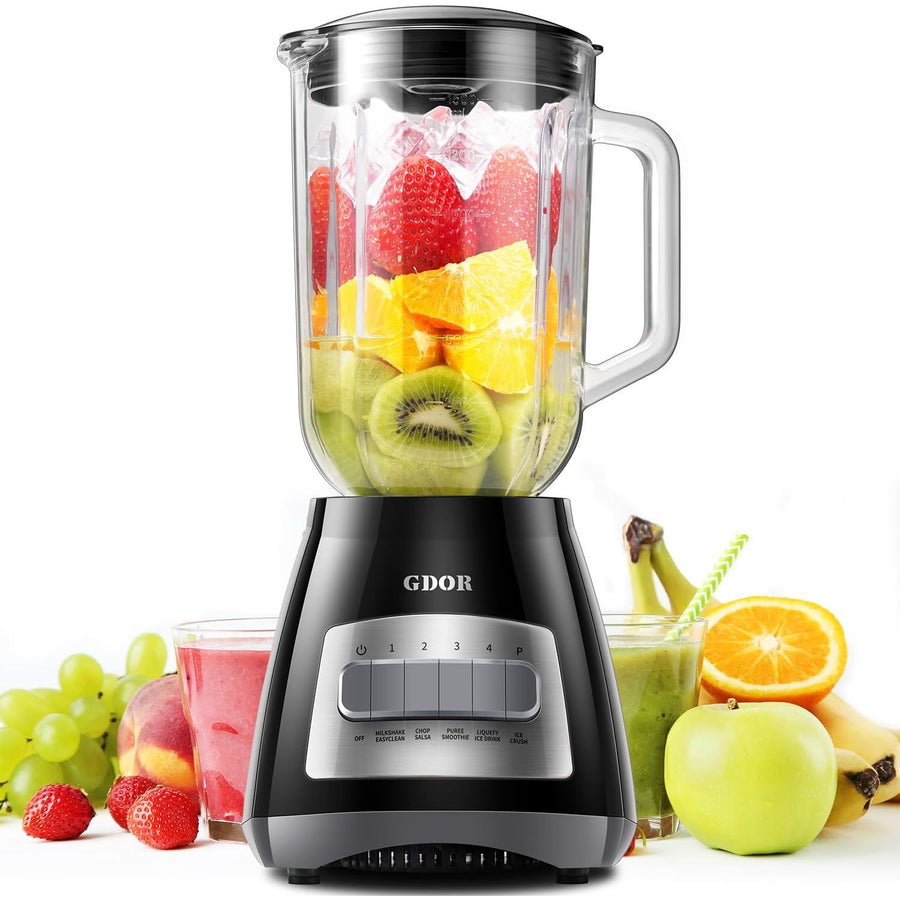 Blender with fruits and a glass of smoothie on a white background