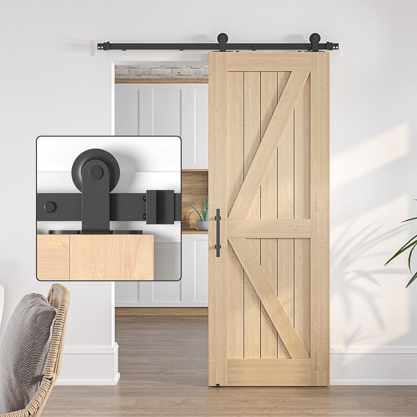 Wooden barn door with black sliding mechanism in a room setting.
