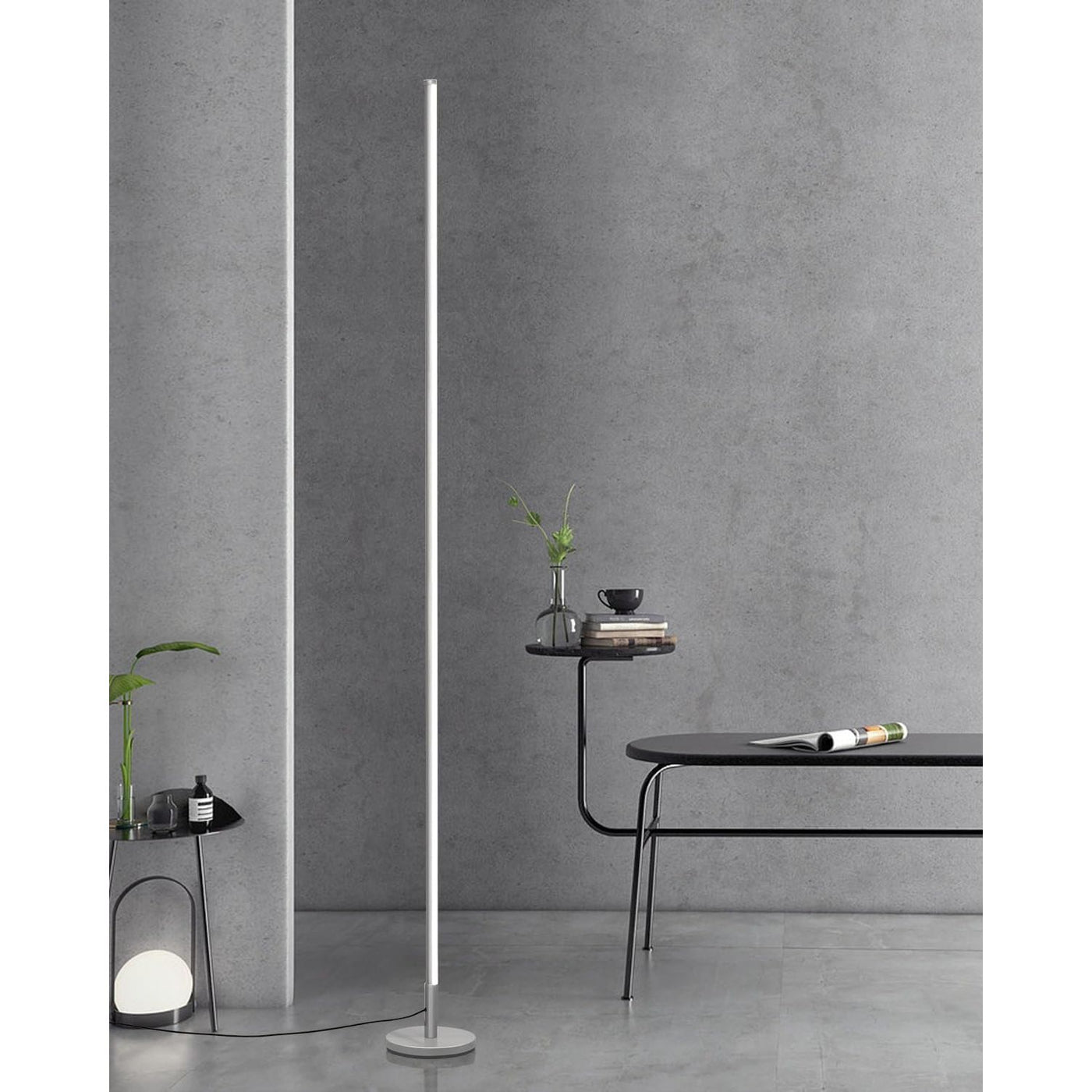 Modern floor lamp against a gray wall with minimal decor