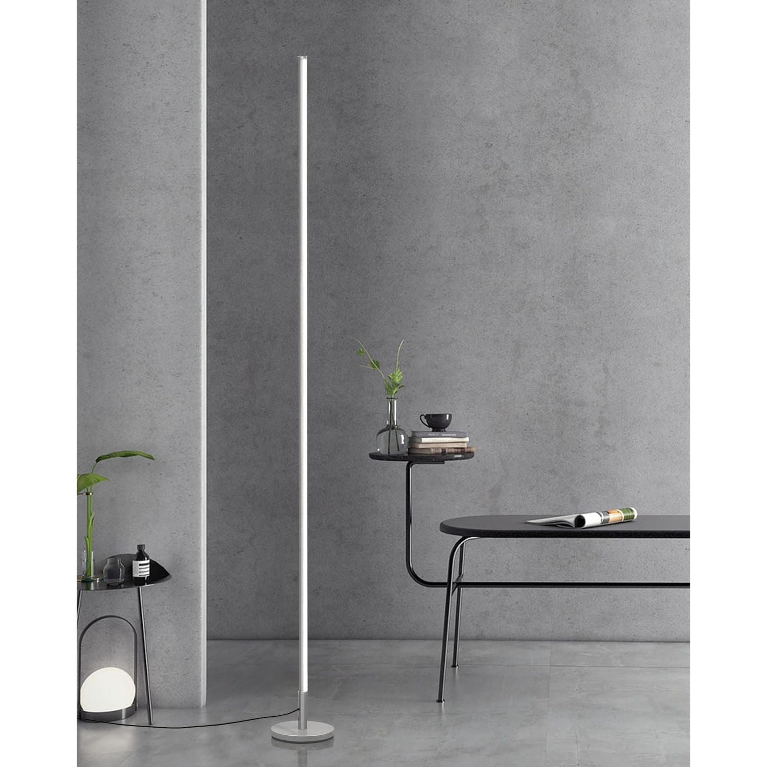 Modern floor lamp against a gray wall with minimal decor