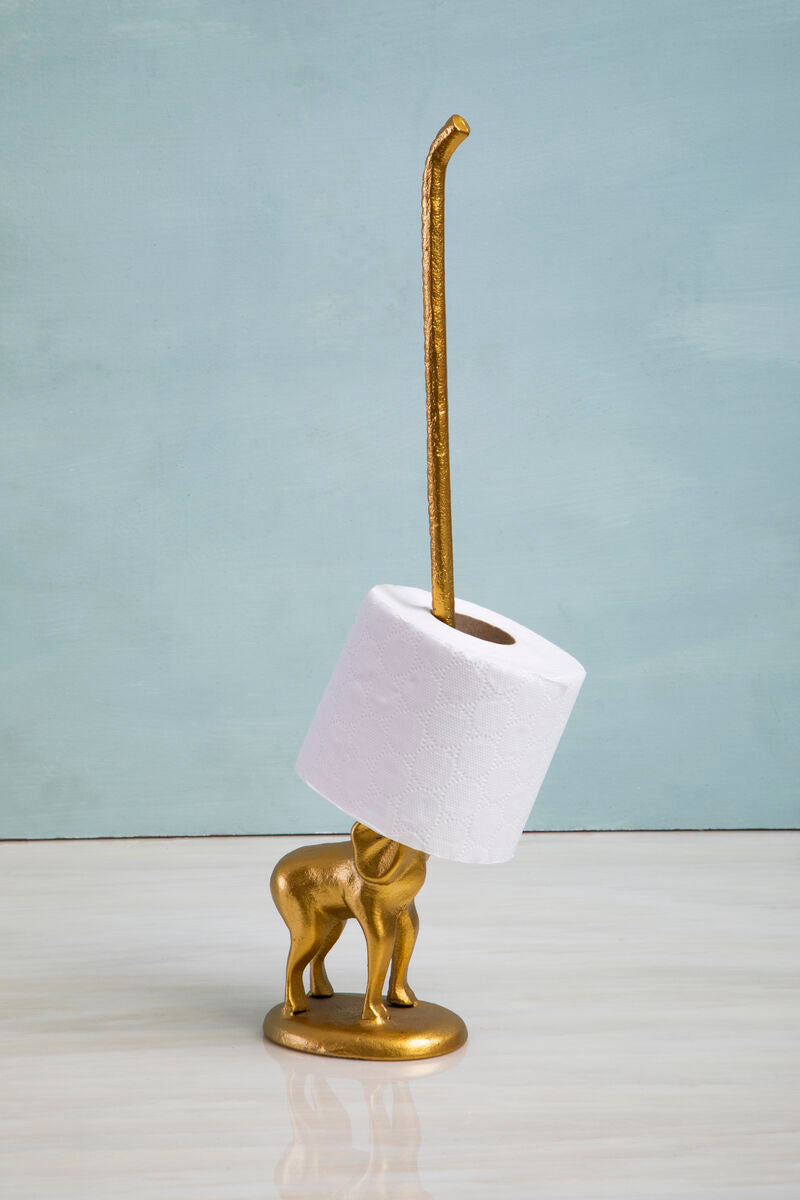 Gold elephant-shaped holder with a roll of toilet paper on a light blue background