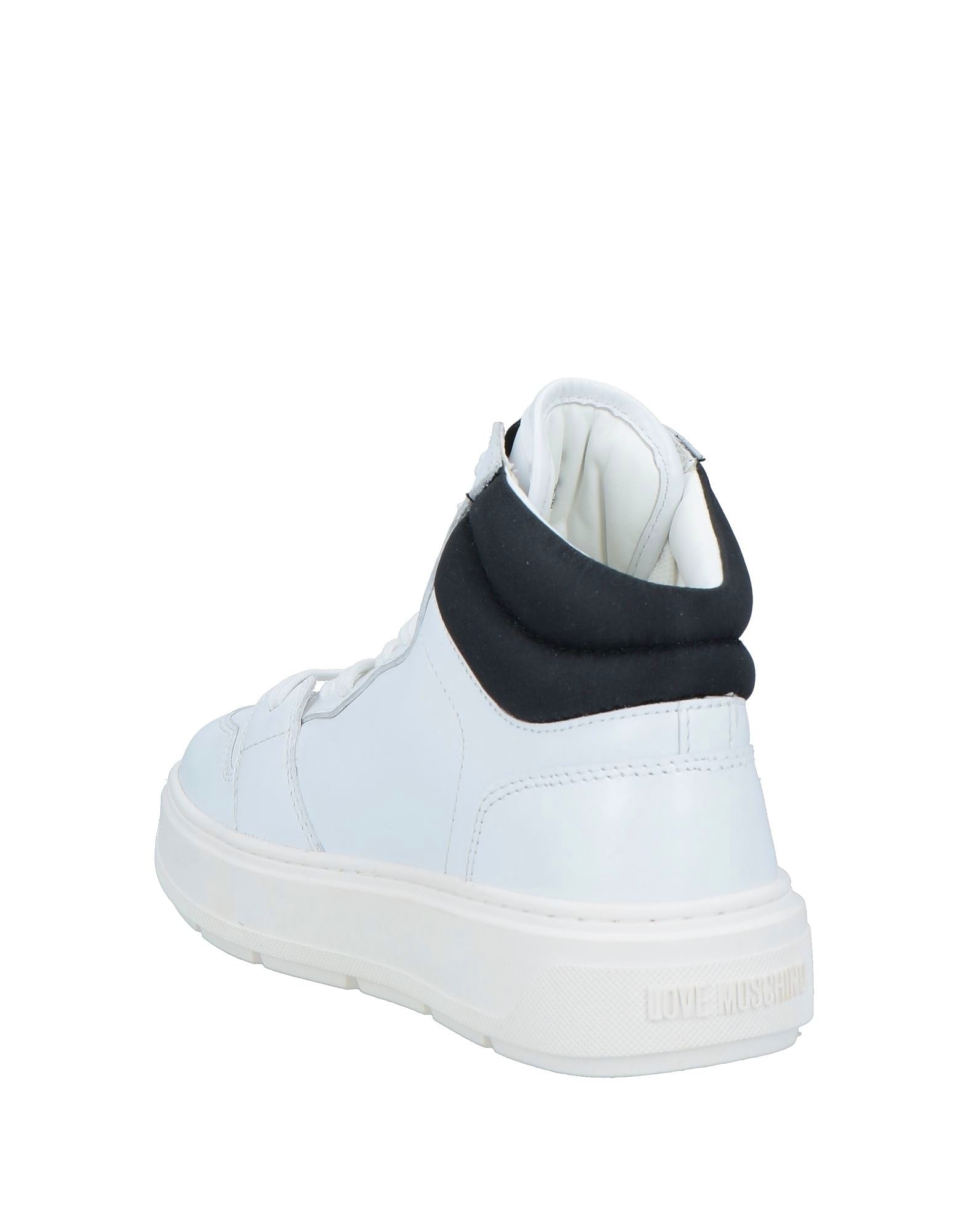 White sneaker with black collar on a white background