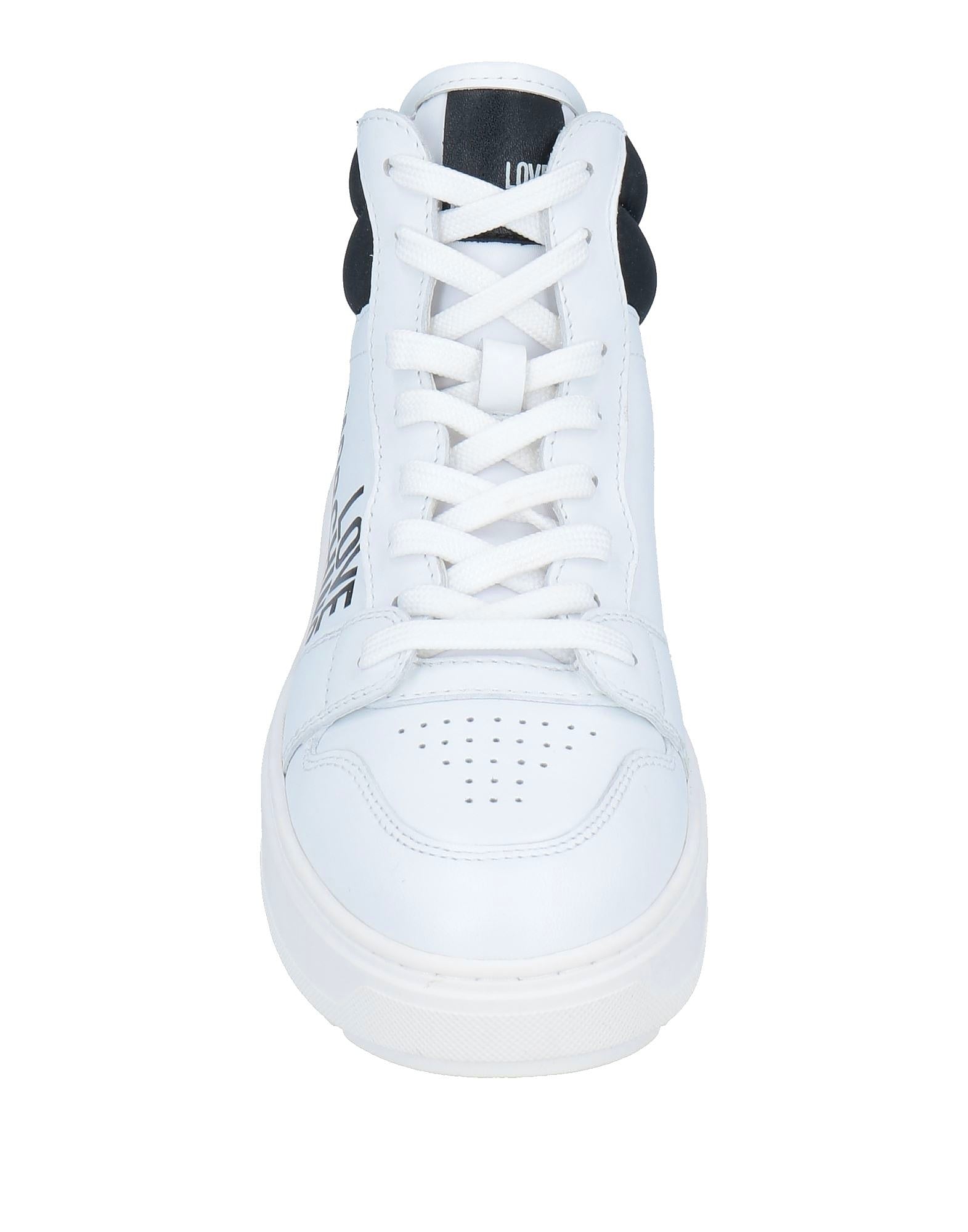 White sneaker with black accents on a white background