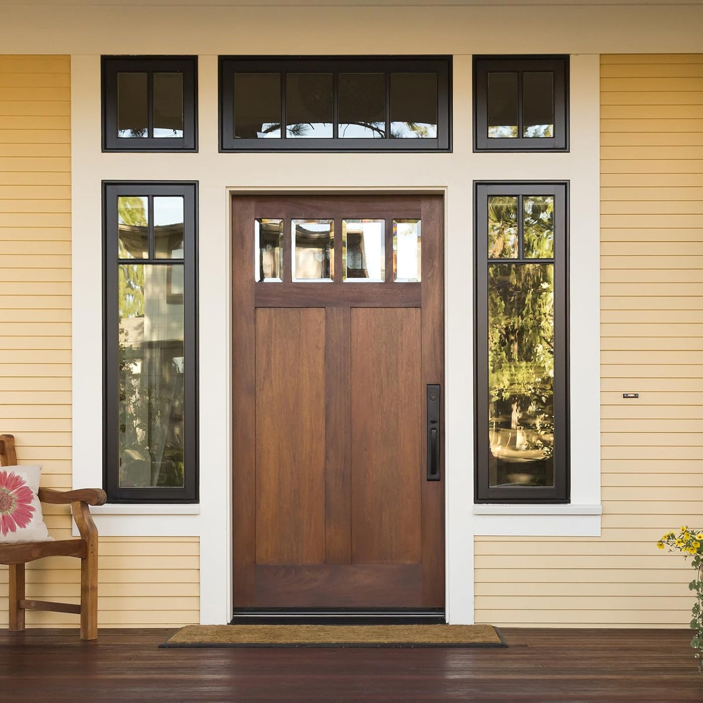Wooden front door with glass panels on a house exterior
