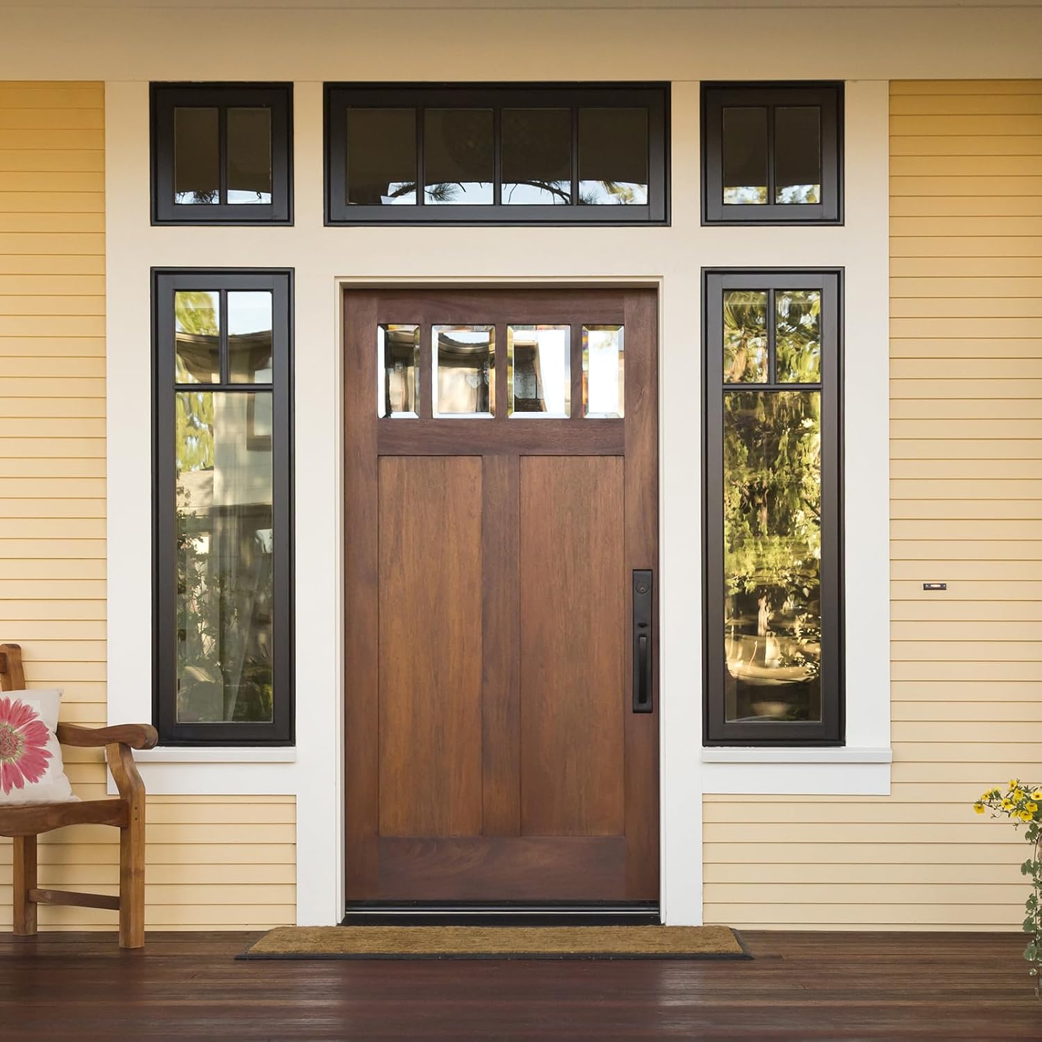 Wooden front door with glass panels on a house exterior