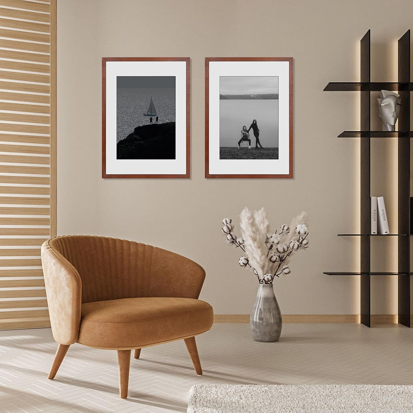 Modern living room with brown armchair, framed pictures, and decorative vase.