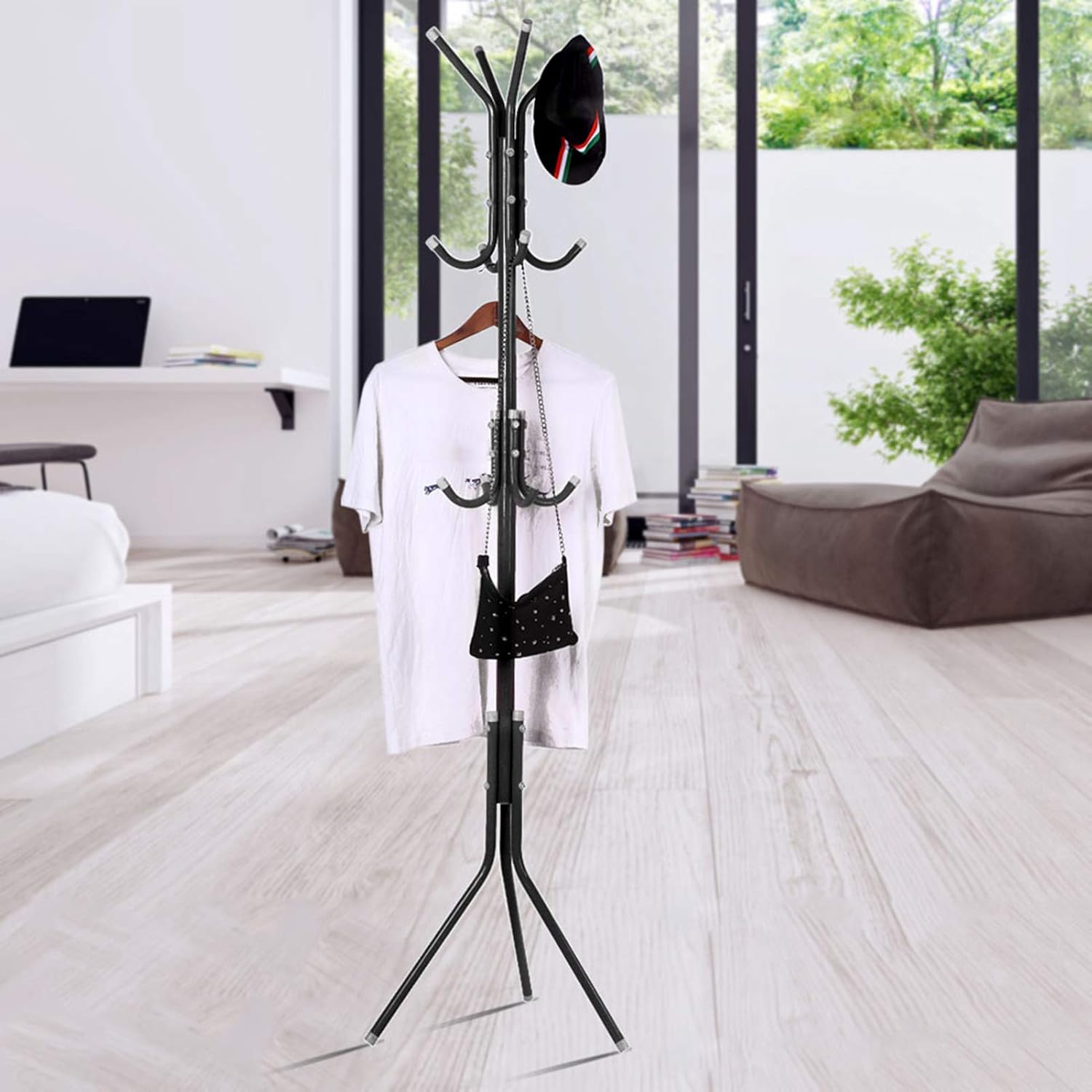 Black coat rack with clothes in a modern living room