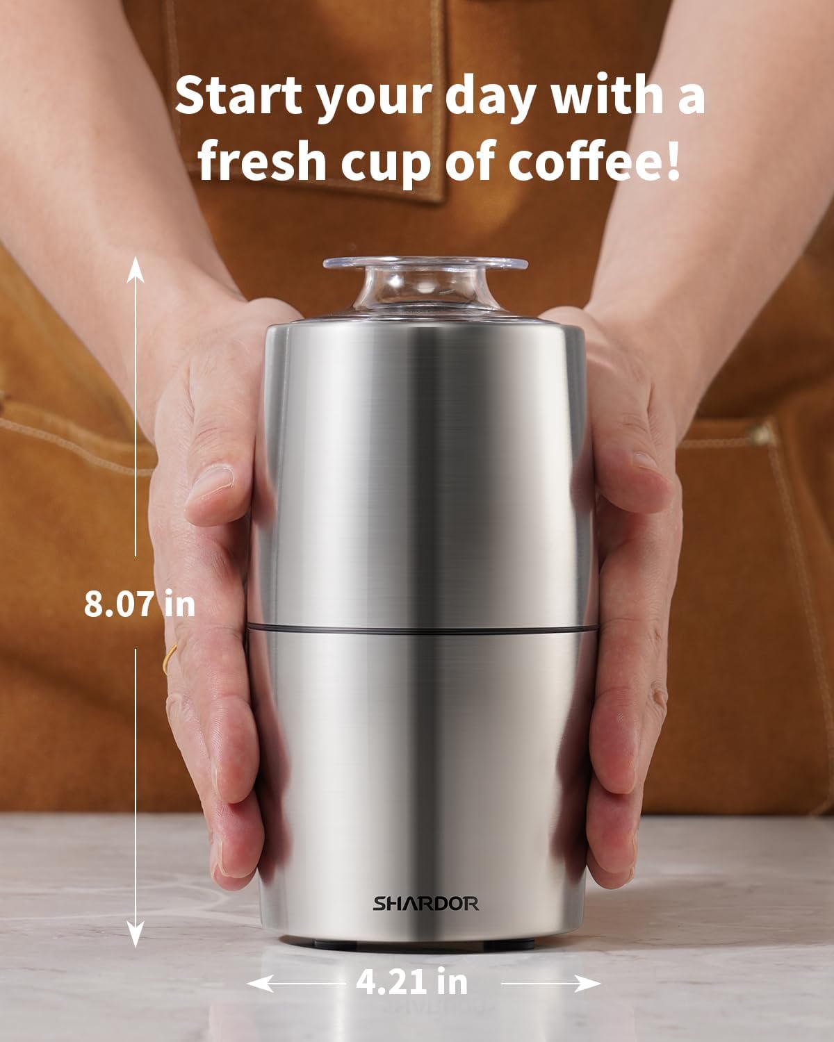 Silver tumbler held by a person with text 'Start your day with a fresh cup of coffee!' and measurements.