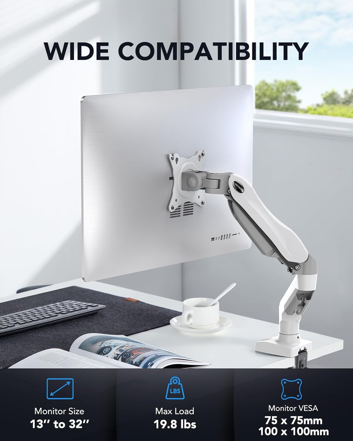 Monitor stand with wide compatibility text on a desk setup